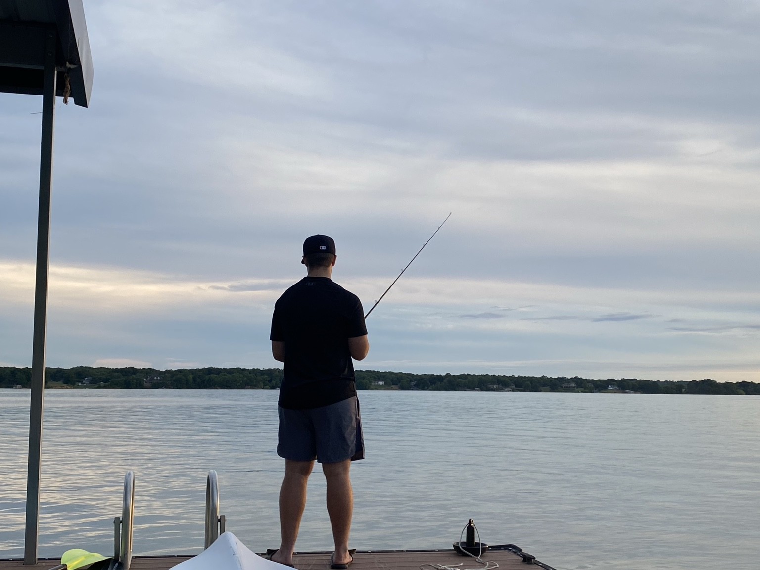 Person fishing from the private dock on Douglas Lake